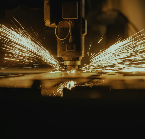 a-piece-of-metal-being-cut-with-a-machine.jpg a piece of metal being cut with a machine
